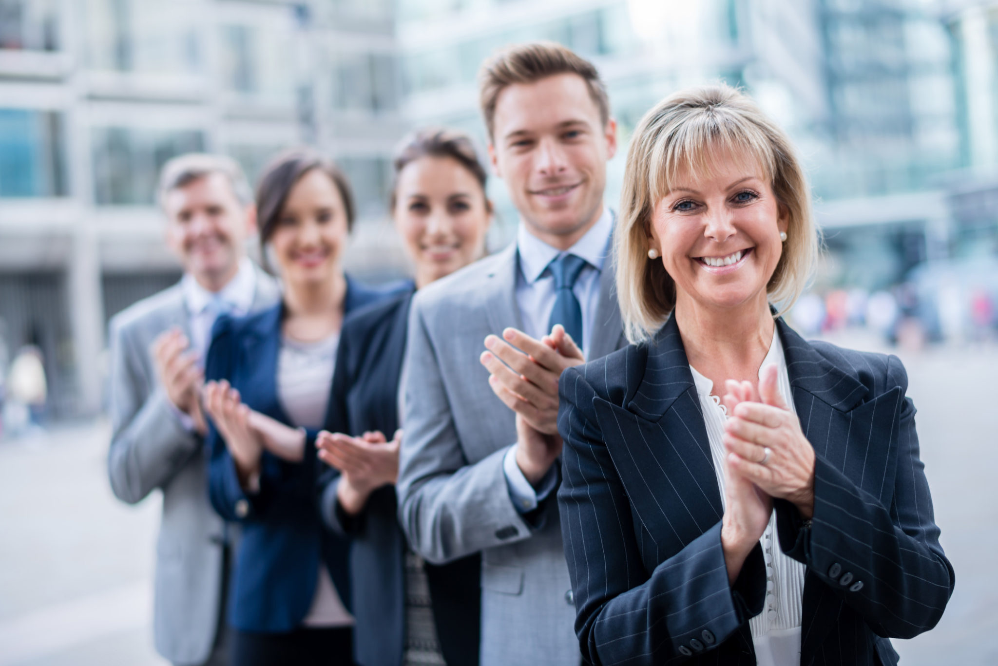 Successful business team applauding the Waukesha County, Wisconsin Bar Association